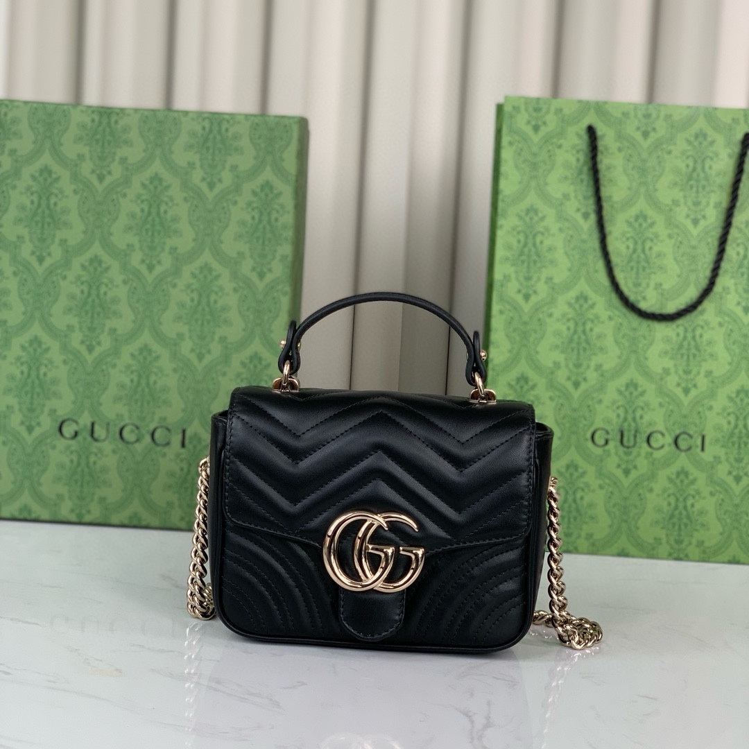 Gucci GG Marmont mini handbag in black quilted V-shaped leather