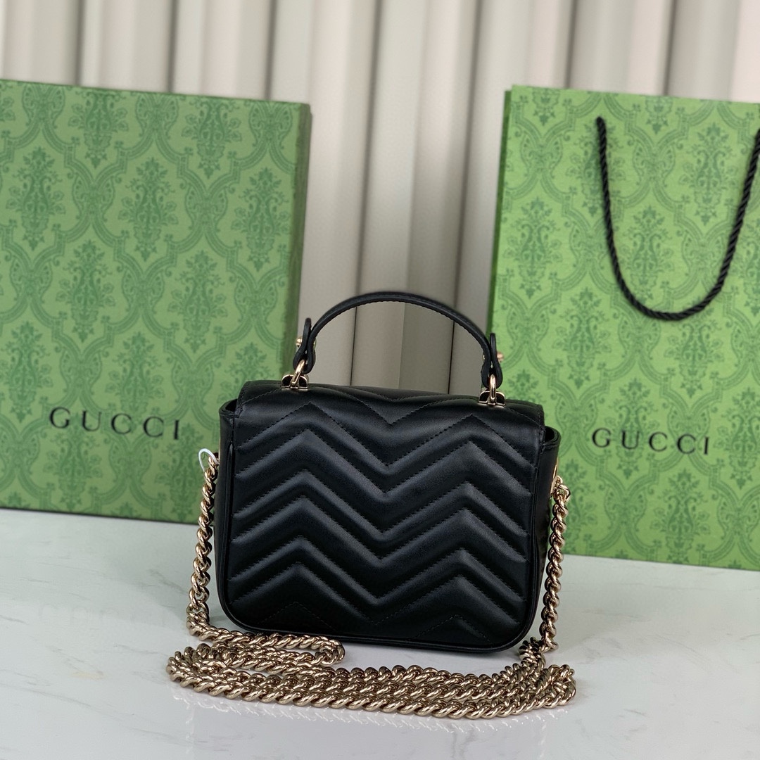 Gucci GG Marmont mini handbag in black quilted V-shaped leather