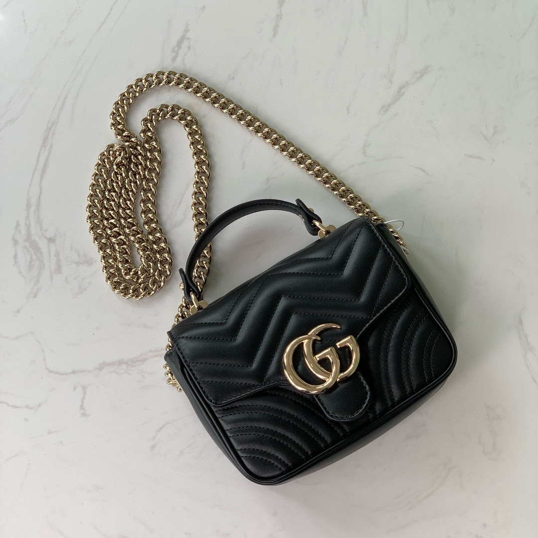 Gucci GG Marmont mini handbag in black quilted V-shaped leather