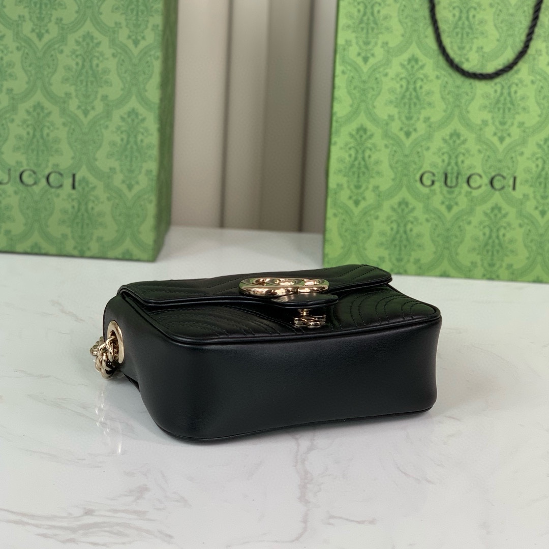 Gucci GG Marmont mini handbag in black quilted V-shaped leather