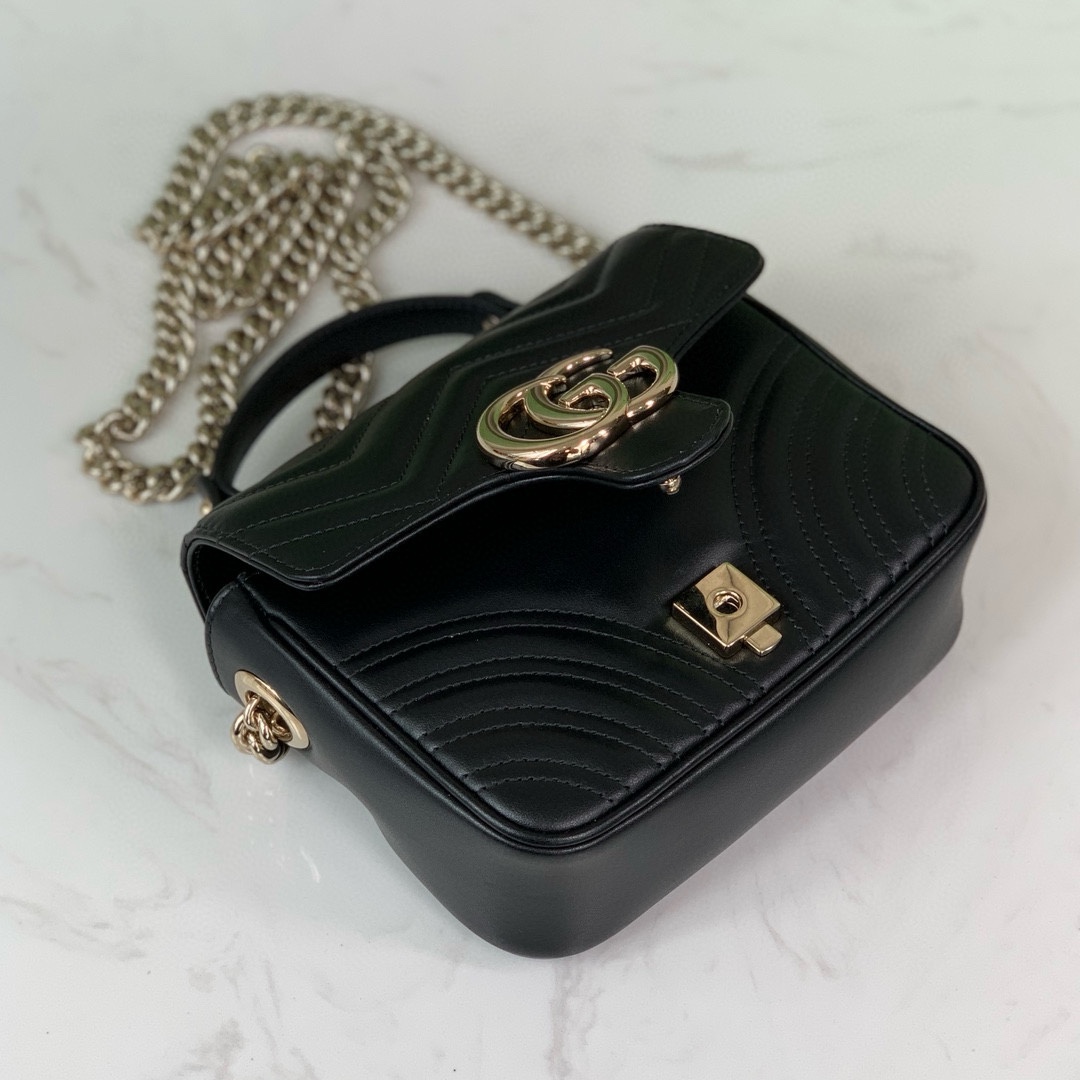 Gucci GG Marmont mini handbag in black quilted V-shaped leather