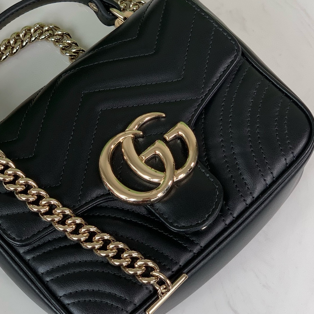 Gucci GG Marmont mini handbag in black quilted V-shaped leather