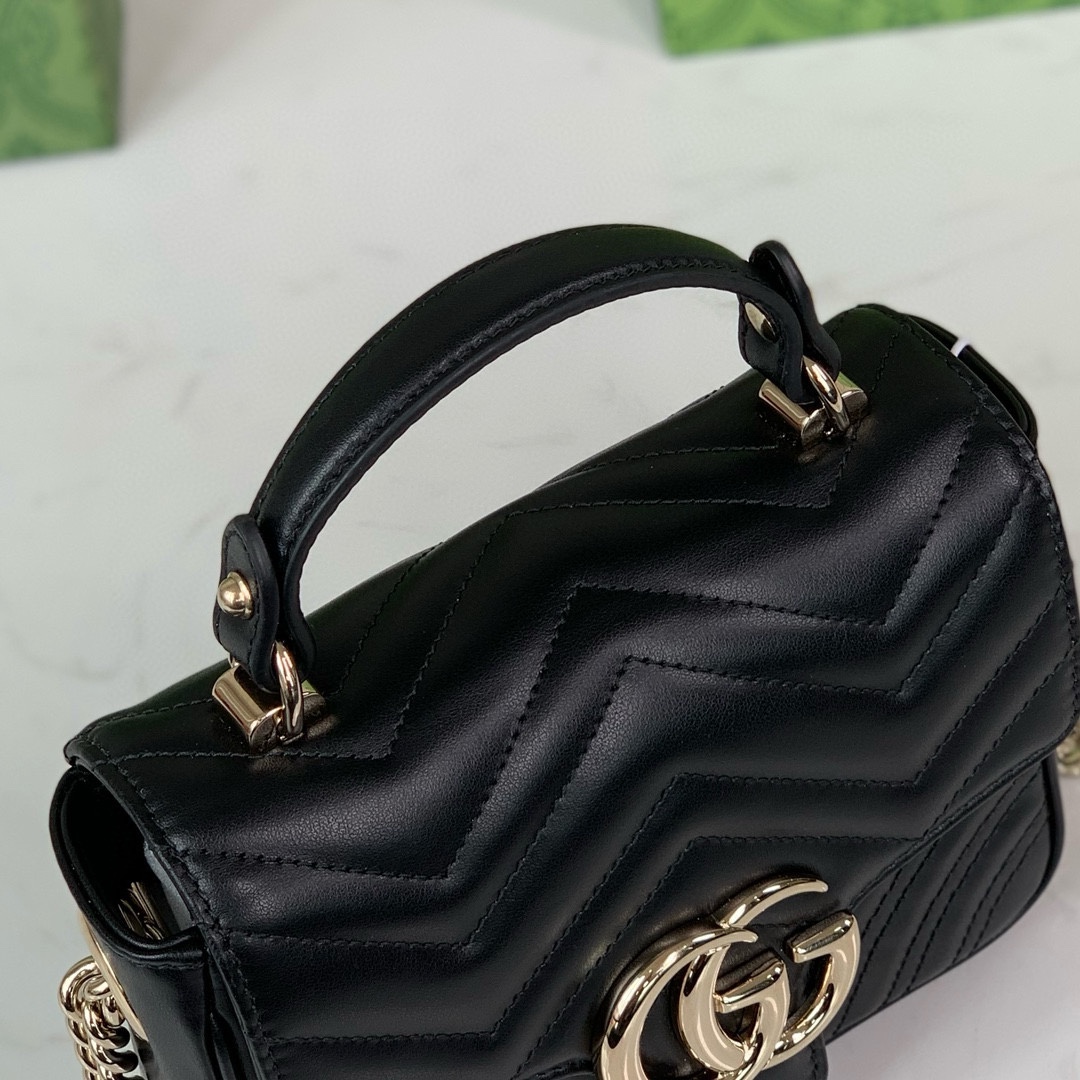 Gucci GG Marmont mini handbag in black quilted V-shaped leather