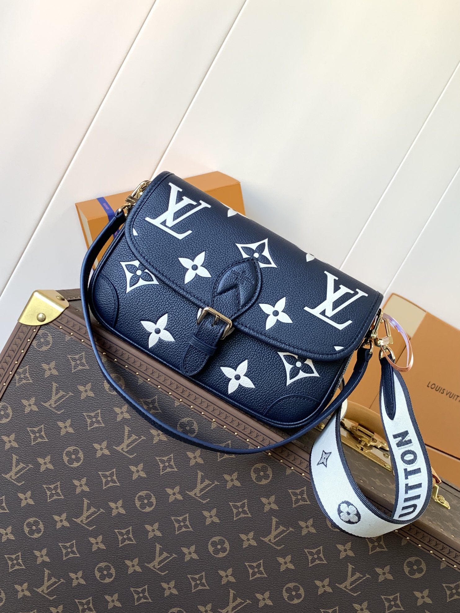 Variable Code Chip LV M47161 Blue Diane Handbag Monogram Empreinte embossed leather removable wide jacquard shoulder strap