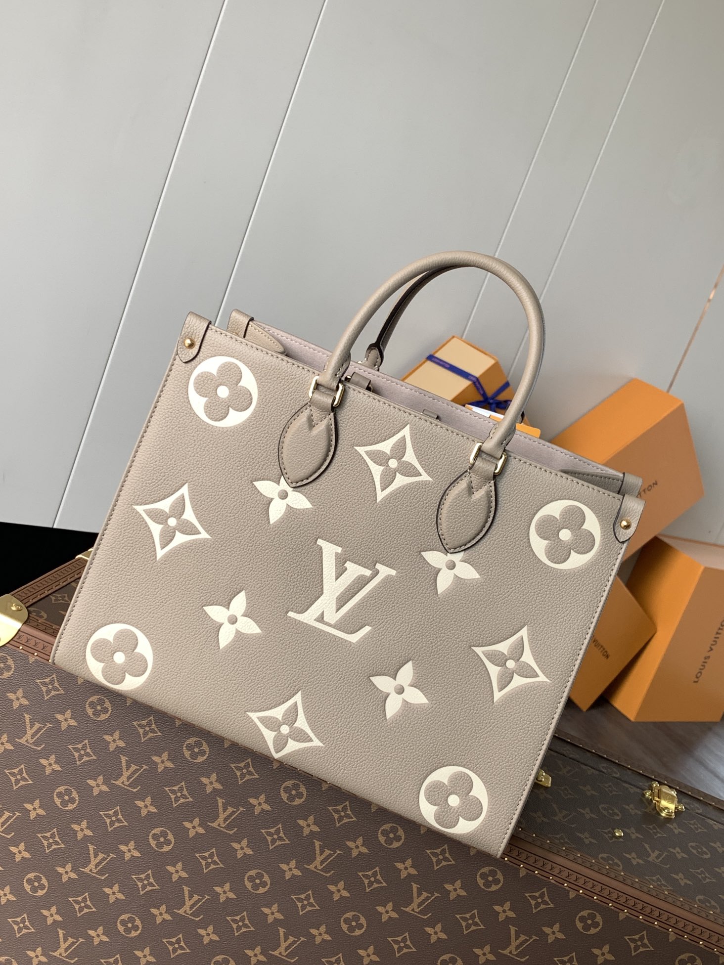 Variable Code Chip LV M45494 apricot printing OnTheGo medium handbag. Monogram Empreinte leather. Rolled leather handle and long