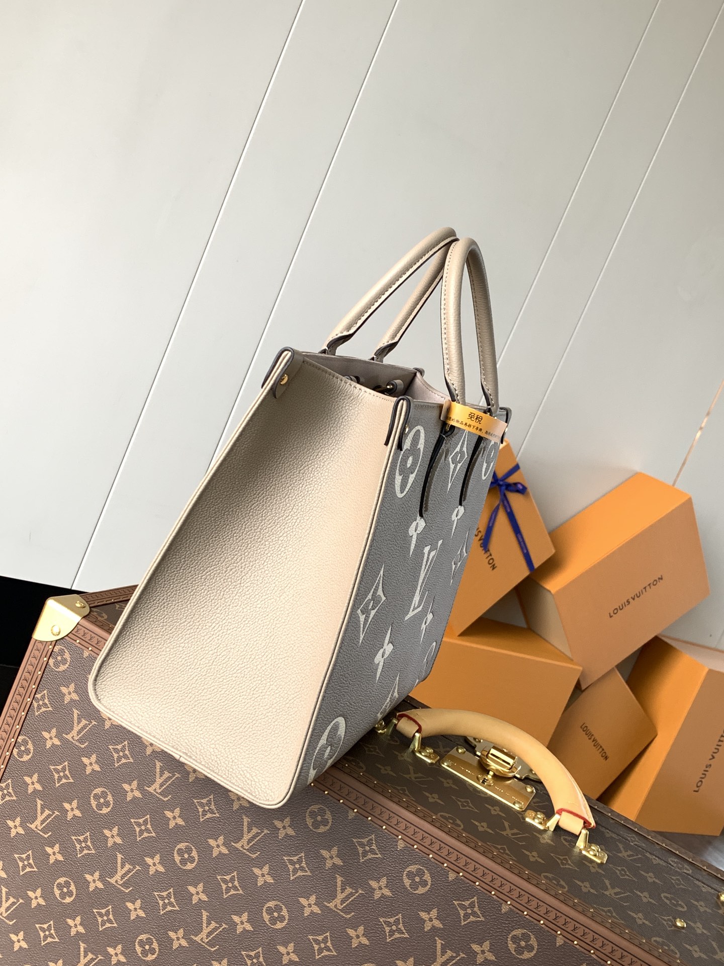 Variable Code Chip LV M45494 apricot printing OnTheGo medium handbag. Monogram Empreinte leather. Rolled leather handle and long