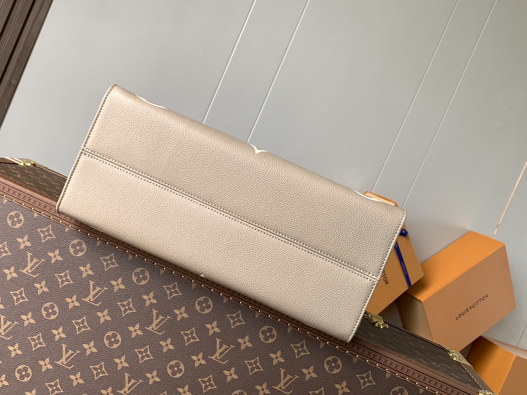 Variable Code Chip LV M45494 apricot printing OnTheGo medium handbag. Monogram Empreinte leather. Rolled leather handle and long