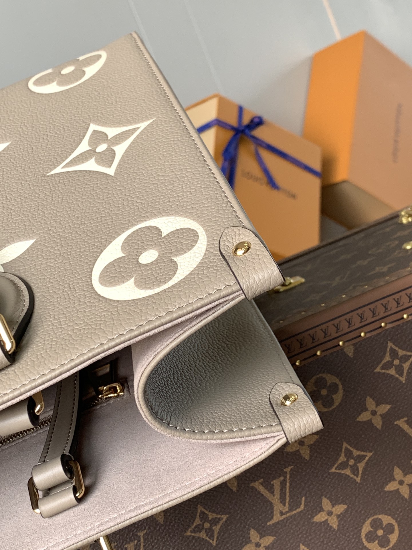 Variable Code Chip LV M45494 apricot printing OnTheGo medium handbag. Monogram Empreinte leather. Rolled leather handle and long