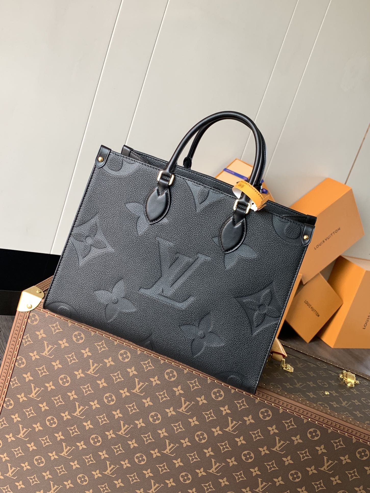 Variable Code Chip LV M45595 Black OnTheGo medium handbag. Monogram Empreinte leather. Rolled leather handle and long shoulder s