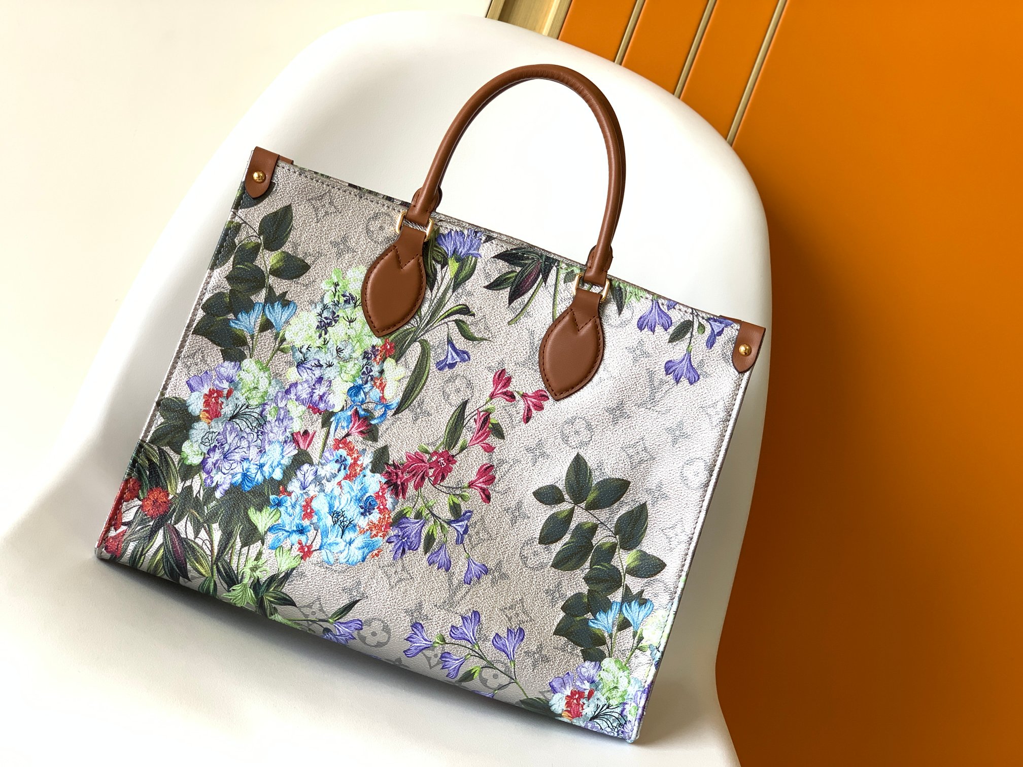 OnTheGo Handbag M21233 by Louis Vuitton LV in White Floral Print Monogram Empreinte Leather