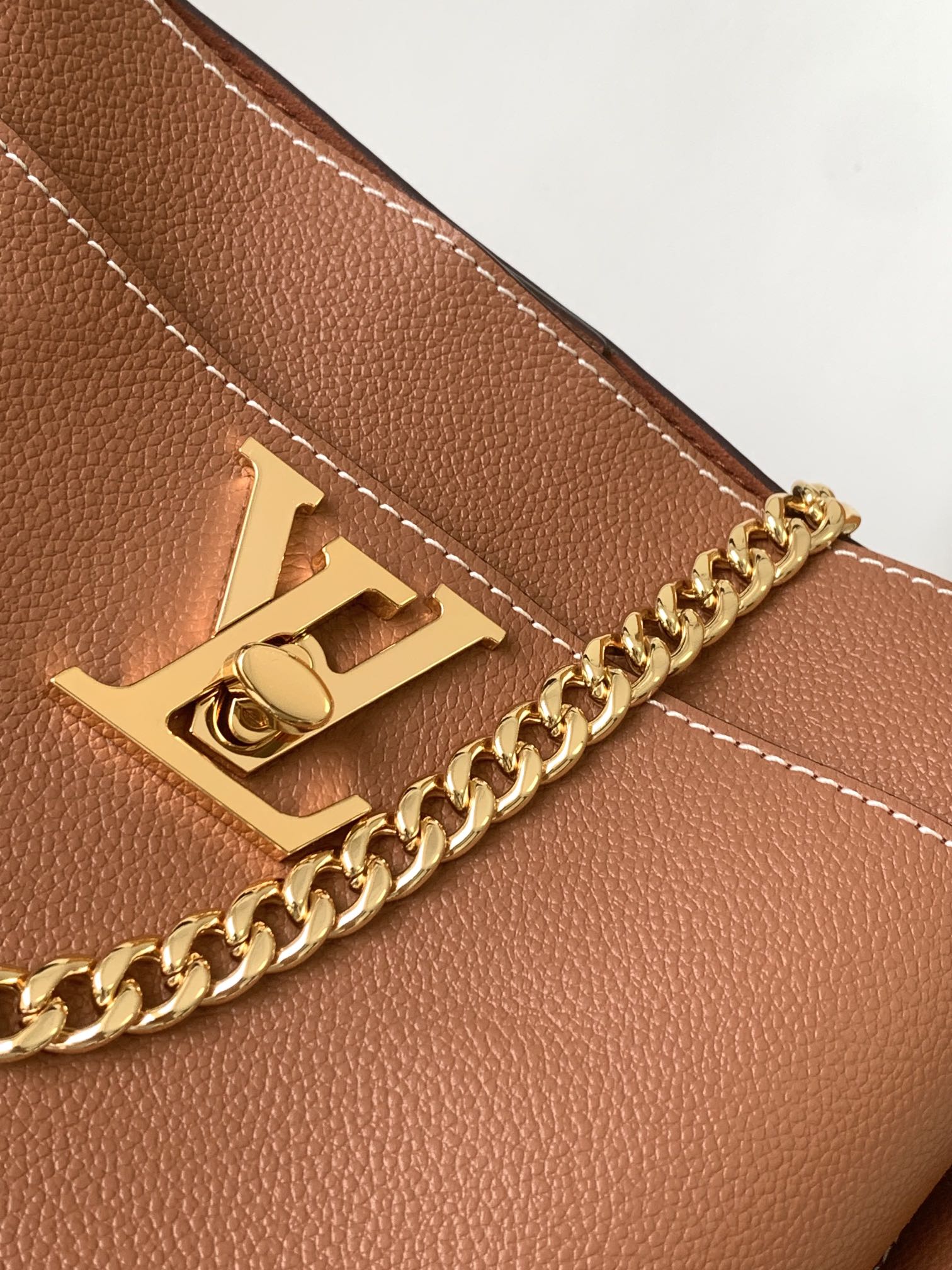  Louis Vuitton LV M24165 Lock and Walk Bucket Bag in Caramel